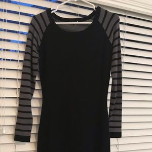 black sweater dress with grey striped sleeve